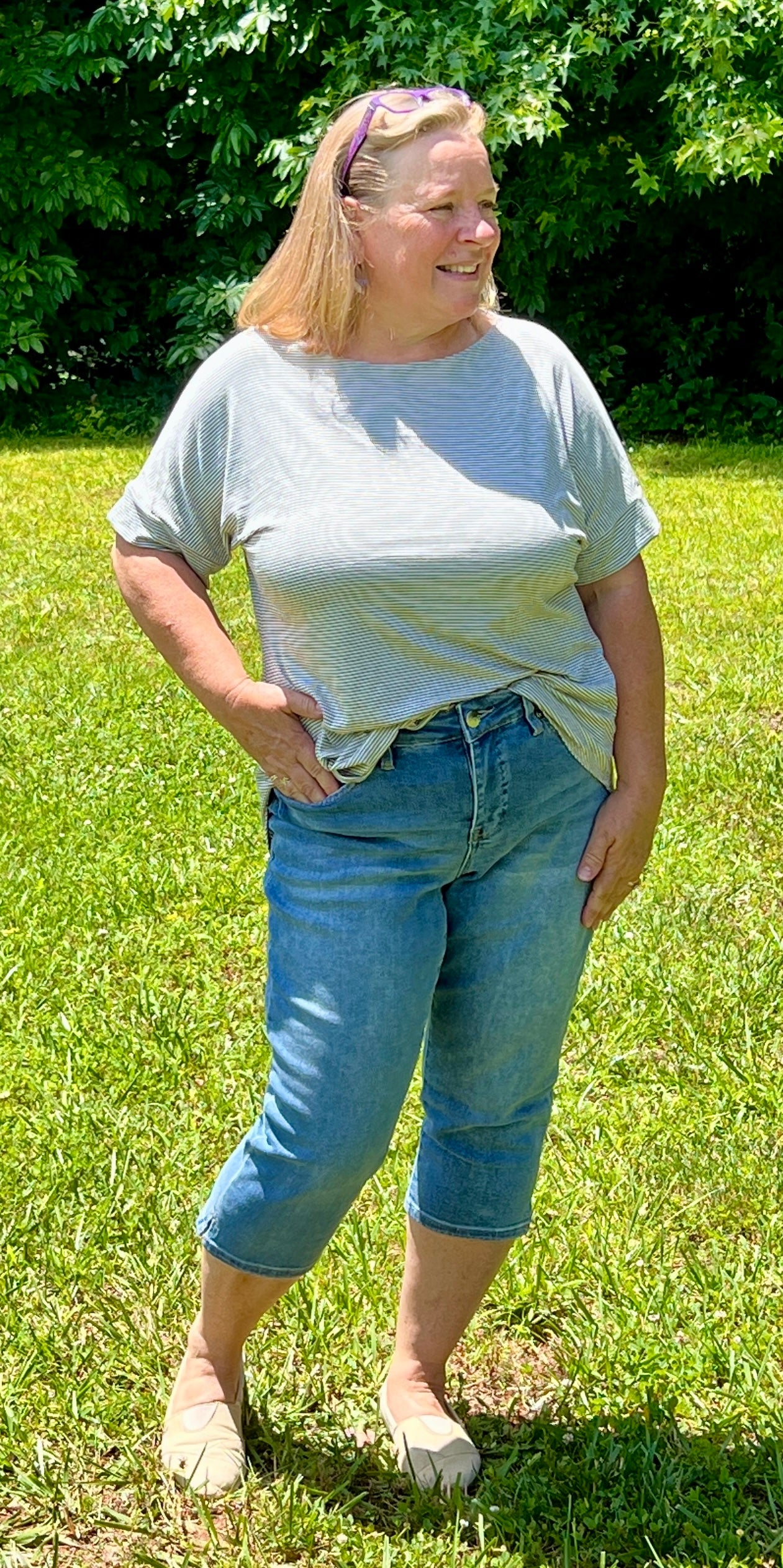 High rise denim jean capris with 5 pocket styling, medium denim color, soft and stretchy. Available in 14-20. The capris you'll want to wear this fall.