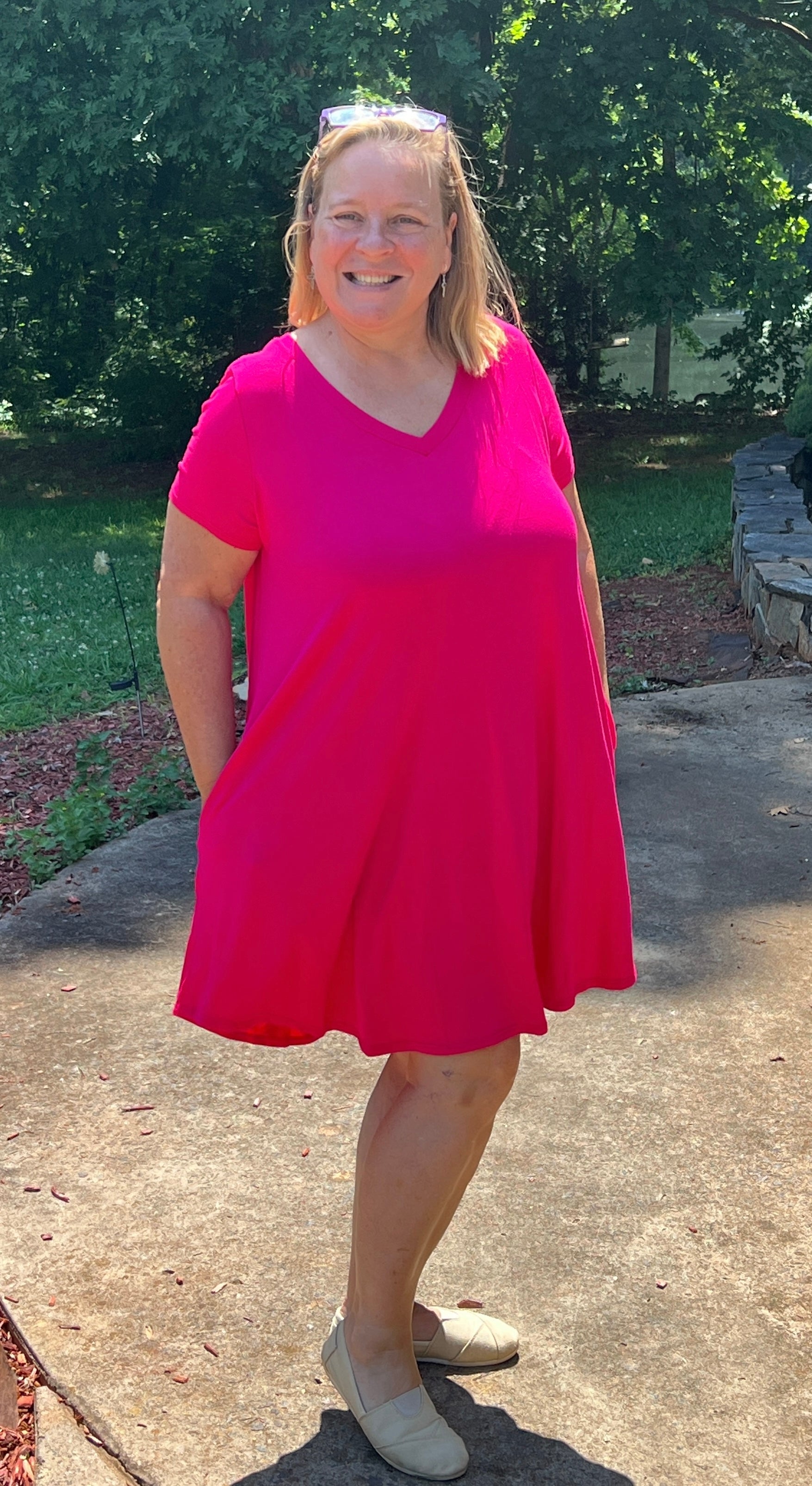 Fuchsia midi length A-line dress in Small to XL. Short sleeves, v-neckline, and pockets. Very flowy, soft feel.