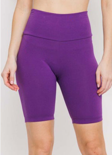 Purple Cotton Spandex blend bike shorts fit a snug TTS. High waistband can roll down. Falls to mid thigh.